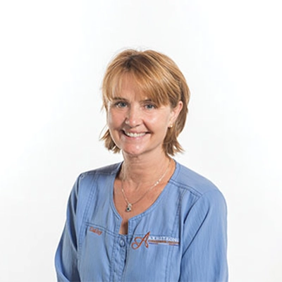 Treatment Coordinator Cathy Smiling In Blue Top